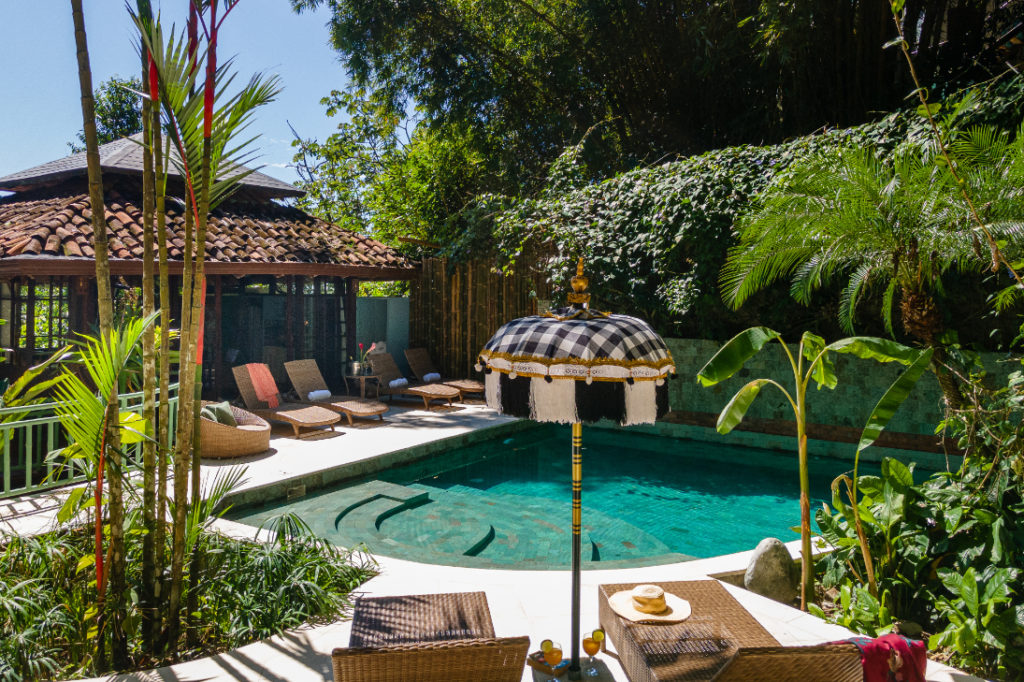 A stylish and secluded pool lounge area.