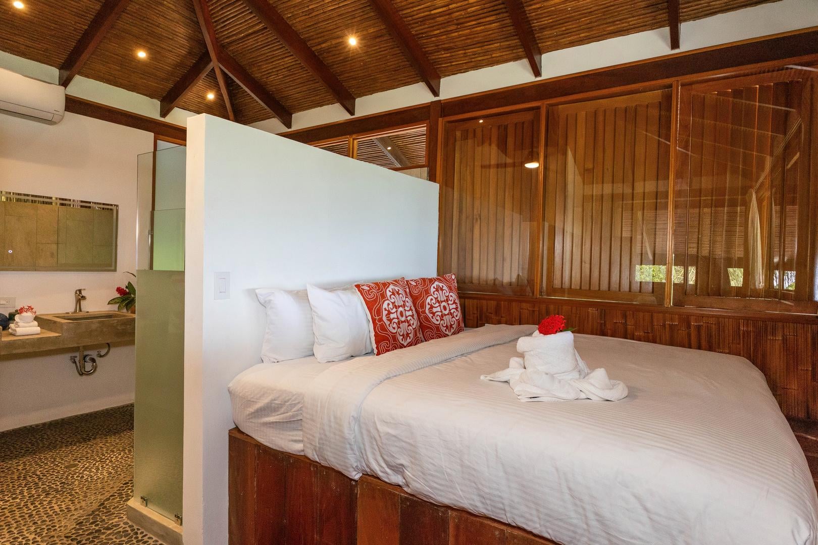 Elevated bedroom with wood interior and jungle views in Manuel Antonio Costa Rica