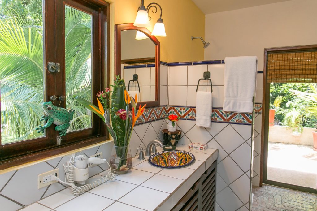 The master bathroom is beautifully designed with a large vanity and his and hers sinks.