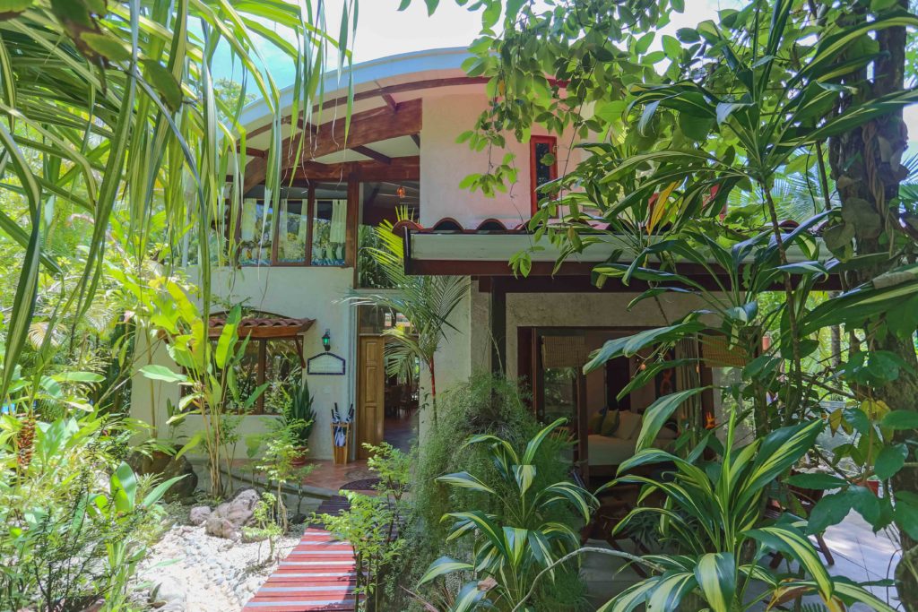 The tropical beauty of the area is reflected in the vibrant plants surrounding you as you enter this beachfront villa.