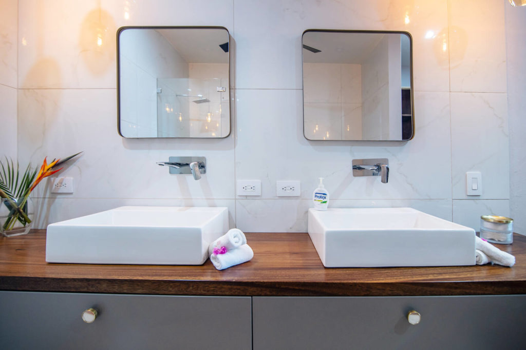 Simple, elegant, his and hers sinks grace the bathroom space.