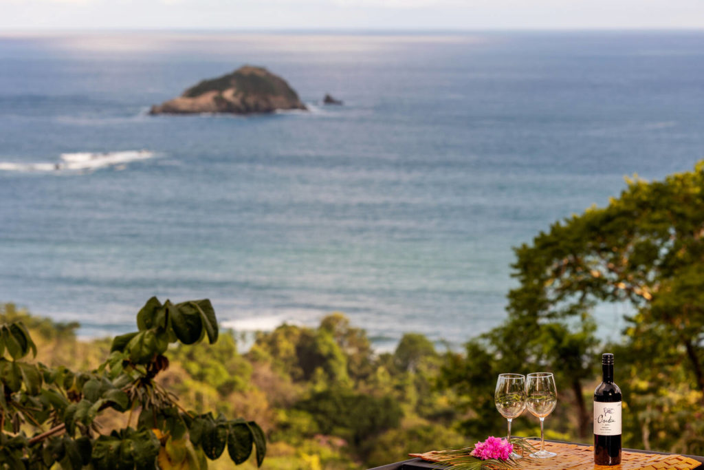 Savor a glass of wine while soaking in your once-in-a-lifetime ocean view.