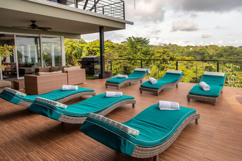 Elegant and luxurious loungers are strategically positioned to soak up the sun while indulging in the breathtaking view.