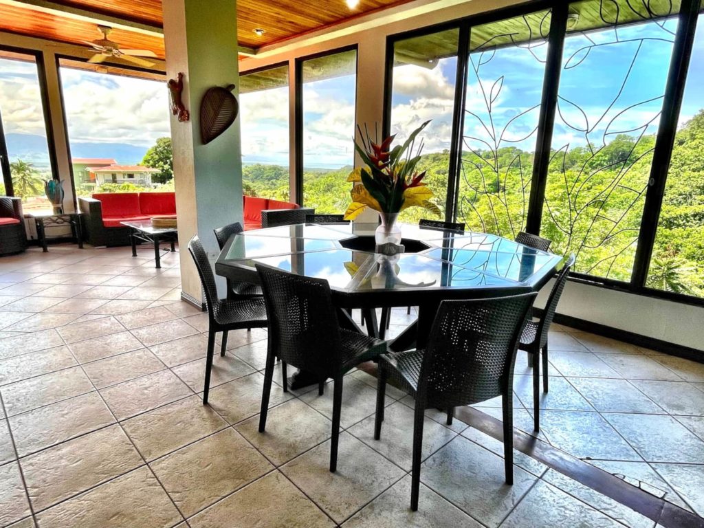 The dining area with forest view is ideally suited for gatherings or enjoying group meals together.