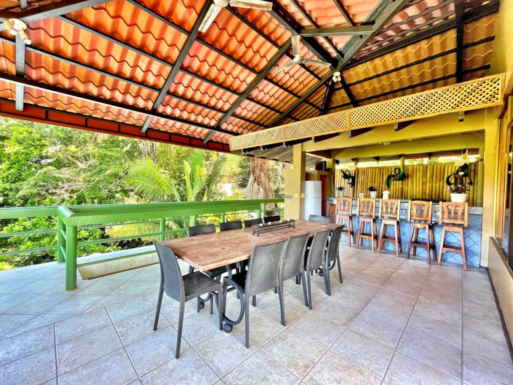 Take in the breathtaking views from the expansive communal deck of this luxurious Manuel Antonio family rental.