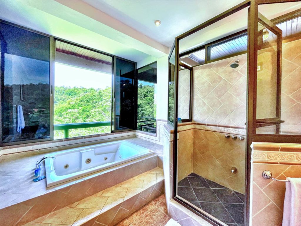 This bathroom offers ample space for indulging in long, refreshing showers after a day at the beach.