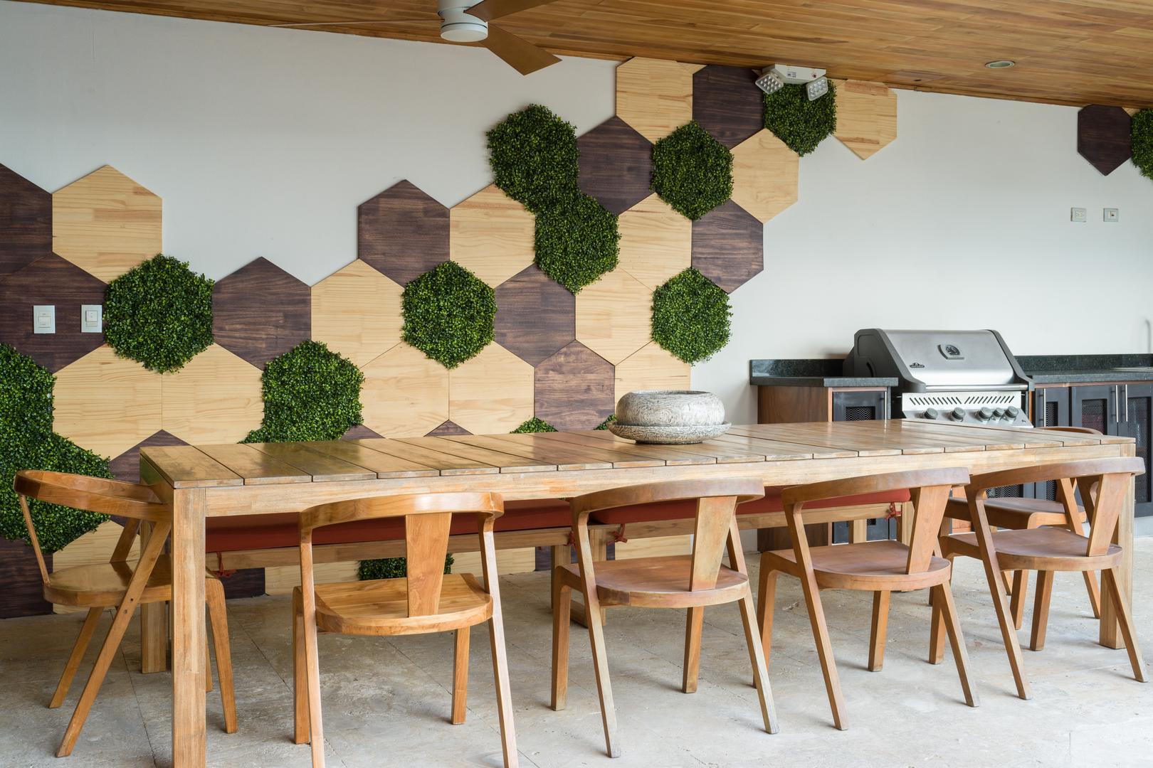 outdoor-dining-area-with-wood-finishes-and-built-in-grill