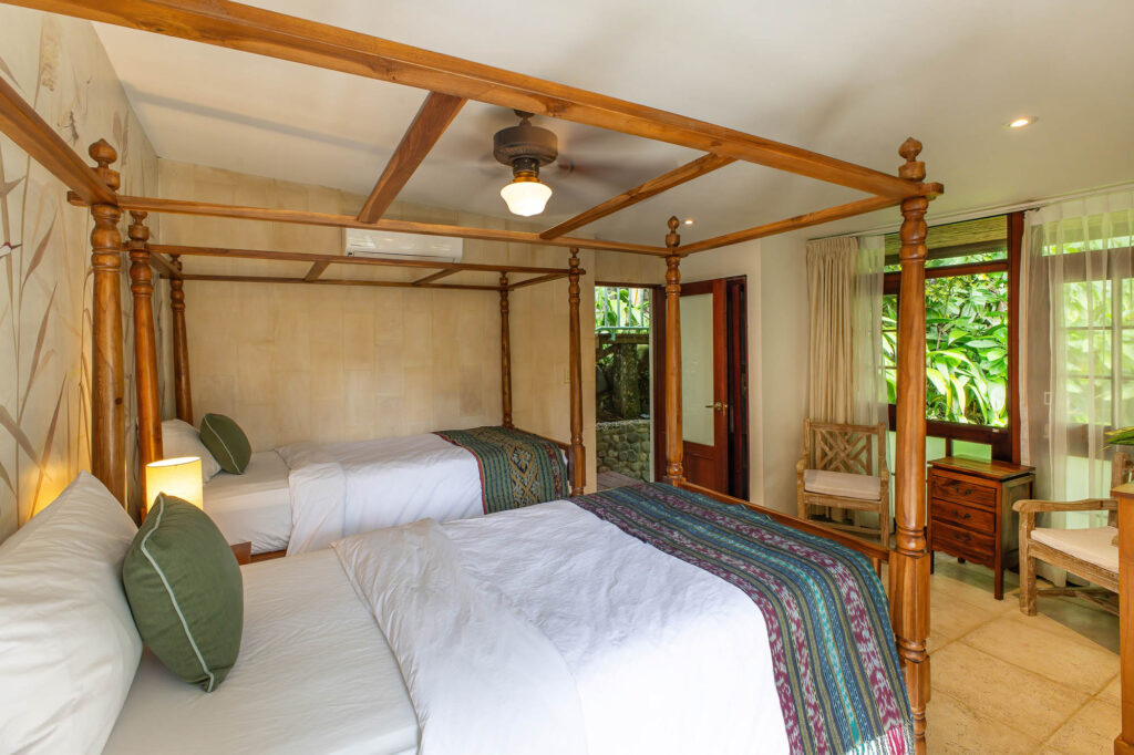 The pool house features a bedroom with an ensuite bathroom, perfect for accommodating the younger members of your group.