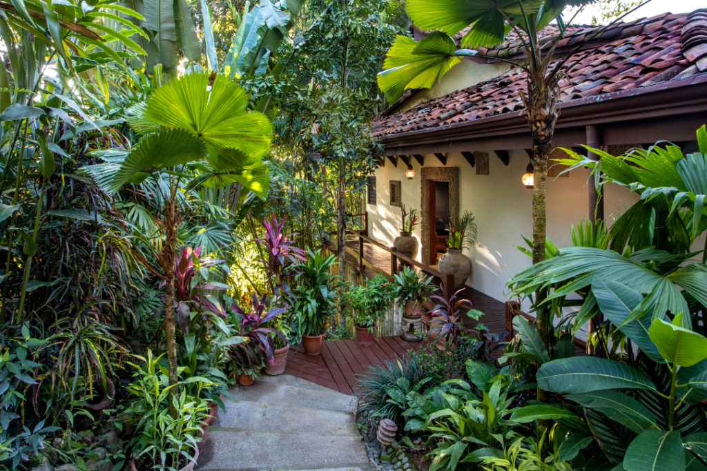 This beautiful vacation home is tucked within lush tropical gardens.