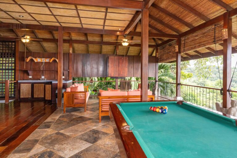 Open-air entertainment room with pool table and seating area in Manuel Antonio Costa Rica