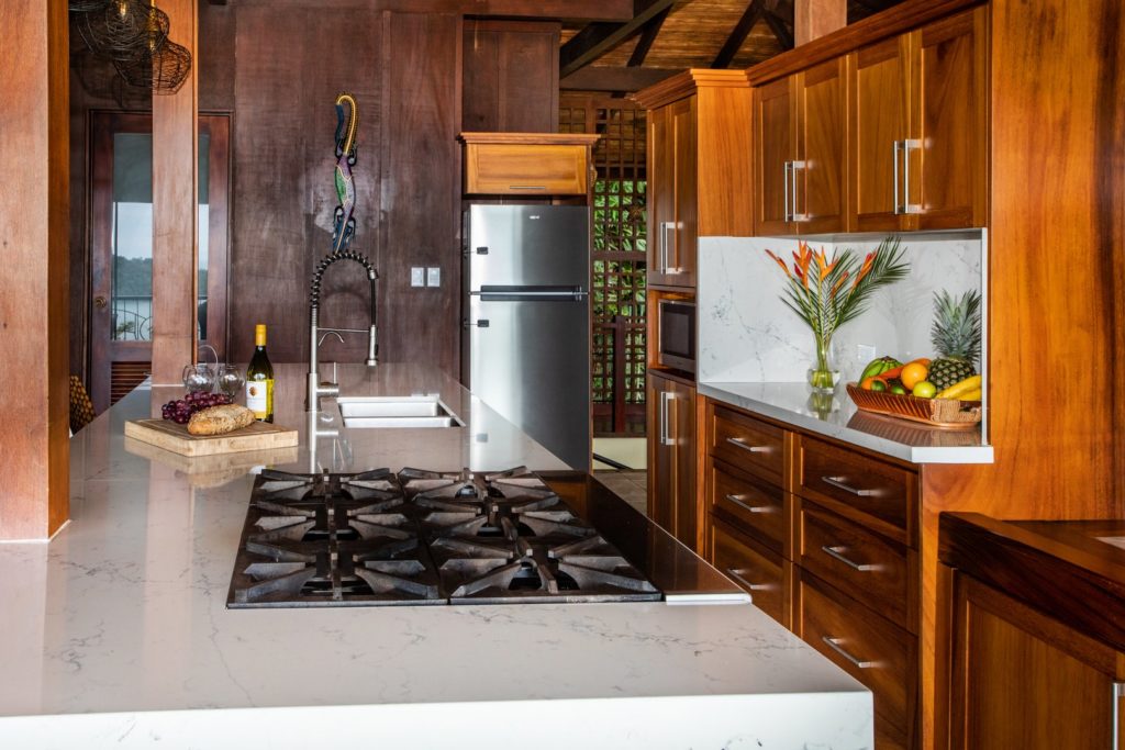 The luxury kitchen has all the modern appliances you could need, stunning wooden cabinets, and granite counters.