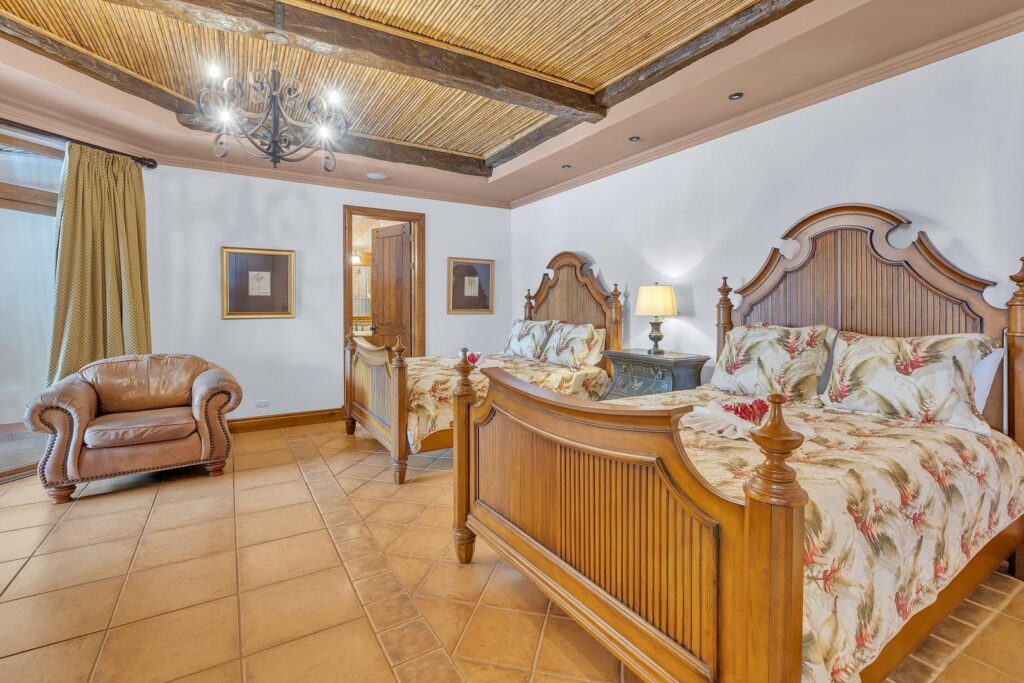 A spacious guest suite with classic details, soft lighting, and plenty of room to relax.