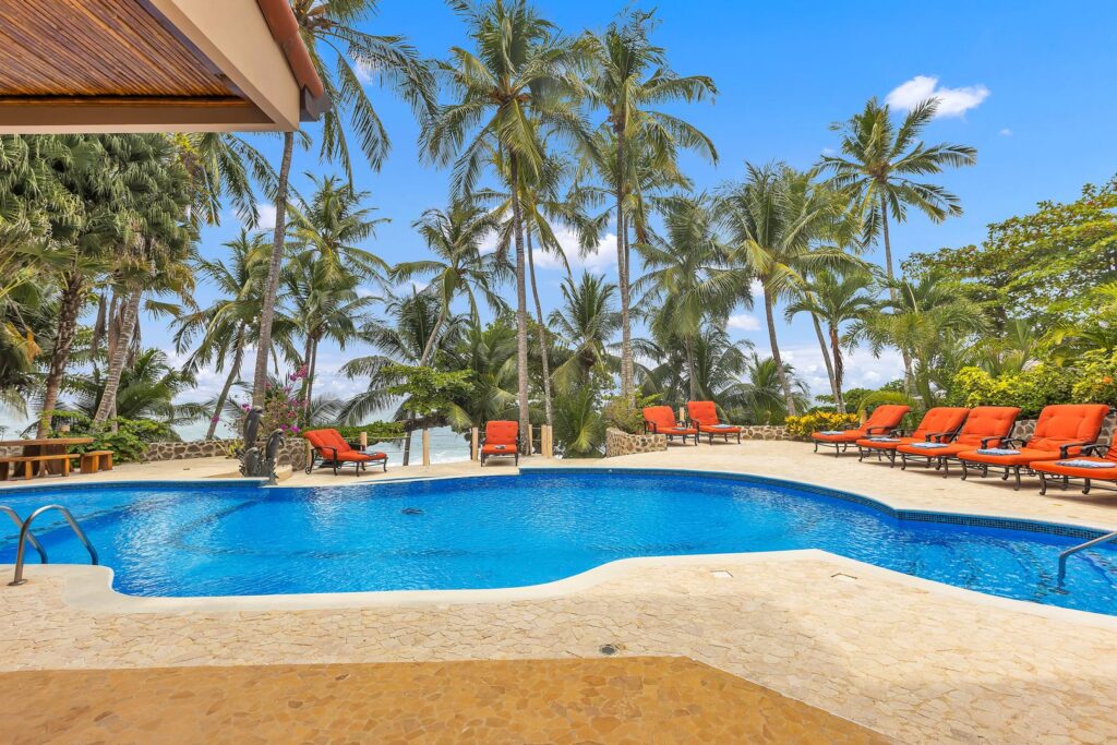 A spacious poolside area designed for relaxing, swimming, and enjoying Costa Rica’s coastline.
