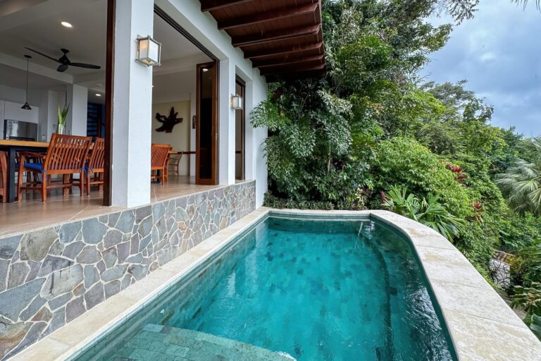 Private pool next to open living area surrounded by tropical vegetation in Manuel Antonio Costa Rica