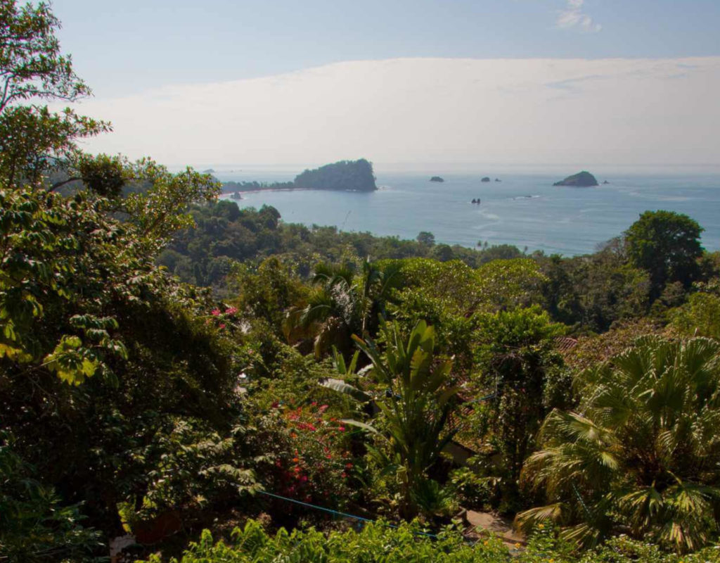 From the pool you can see dense layers of tropical rainforest with the Manuel Antonio National Park behind.