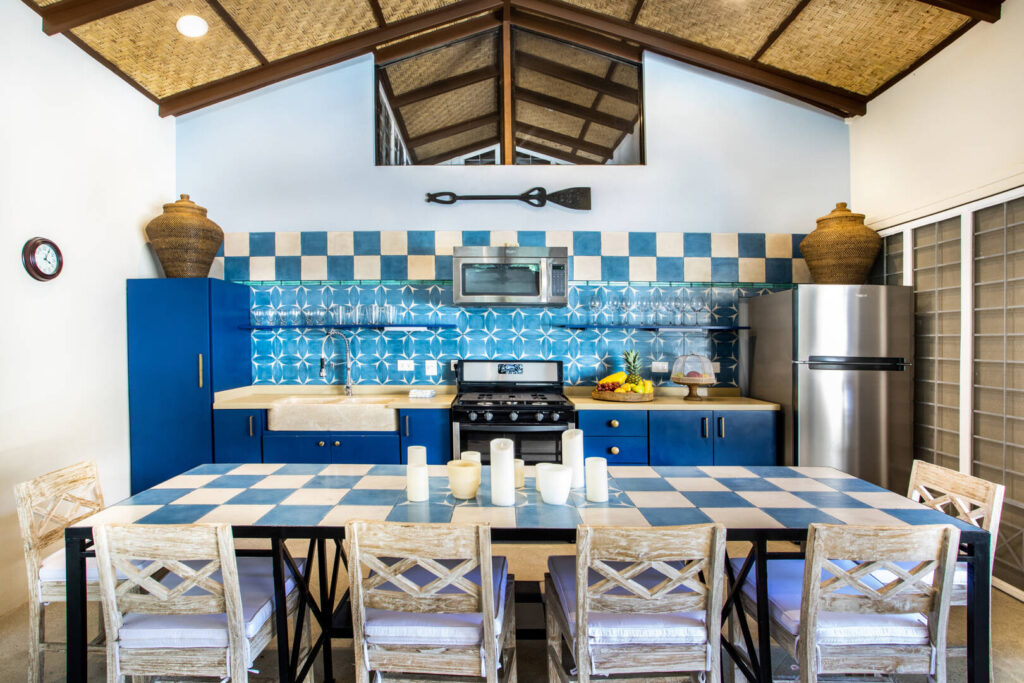 The kitchen and dining area is designed using rustic furniture and tiles.