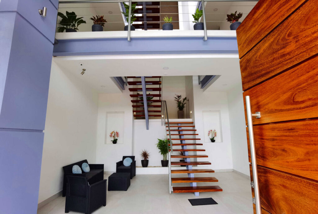 This view of the incredibly-designed stairs shows the careful use of native wood and luxury furnishings.