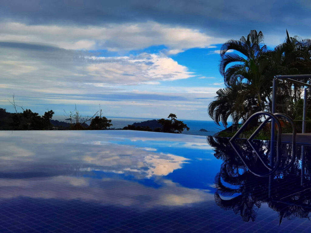 The beautiful Manuel Antonio sky is reflected in your crystal-clear infinity pool.