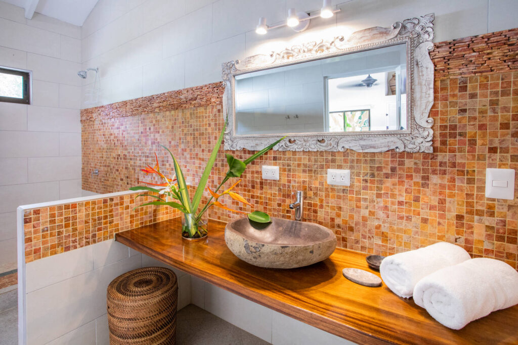 Opulence and luxury with a natural edge in this beautifully-designed bathroom.