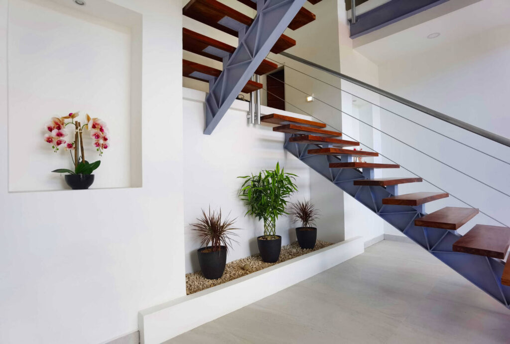 Clean functional design is decorated with vibrant tropical plants.