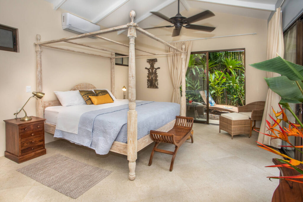 All the bedrooms have air conditioning and this one features a gorgeous wooden king poster bed.