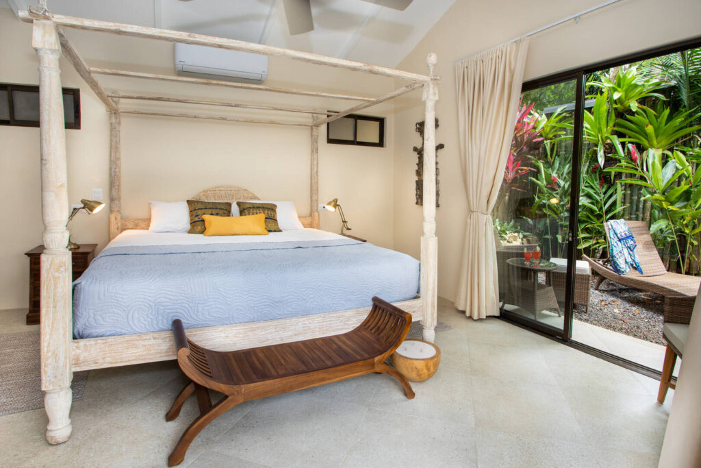 Relax outside your bedroom surrounded by lush tropical plants.