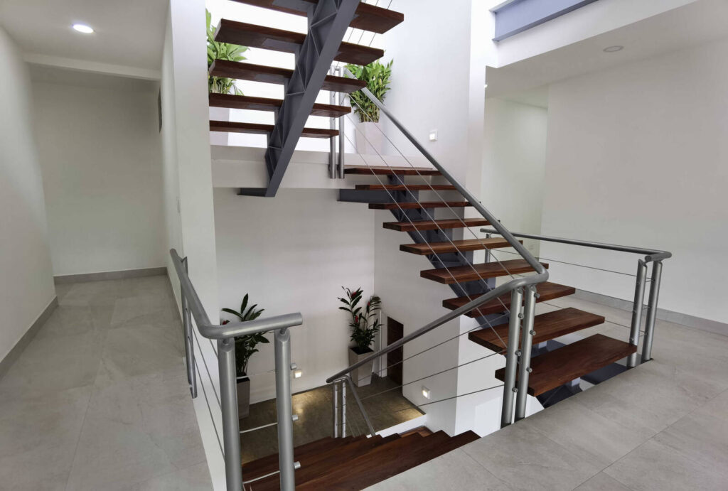 The masterful staircase is a perfect example of beautiful, clean, functional design which features throughout this home.