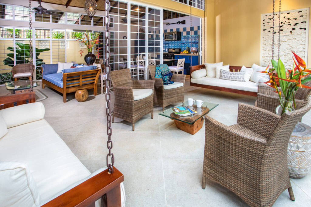 With the glass sliding doors open, the sitting areas combine to create a huge open-air space for all the family.