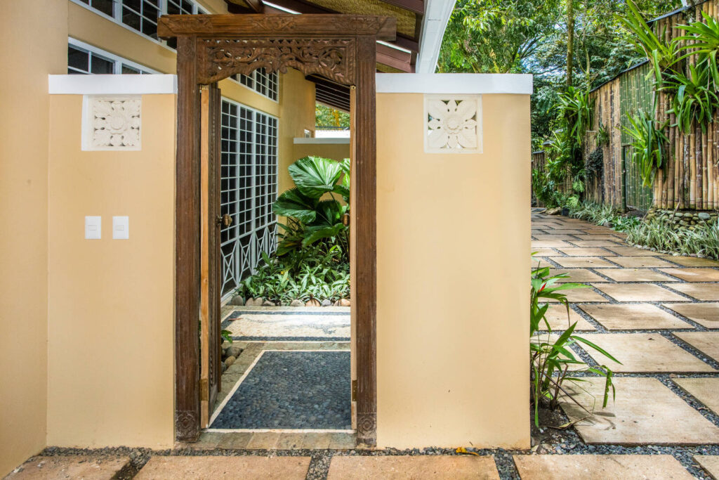 The hand-carved wooden entrance sets the scene for the beautiful details throughout the villa.