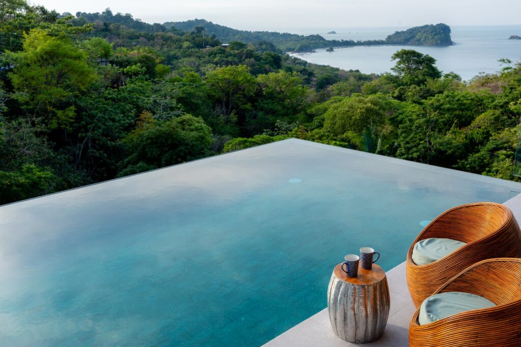 In this breathtaking view, nothing but vibrant rainforest lies between your luxury infinity pool and the beautiful coastline.