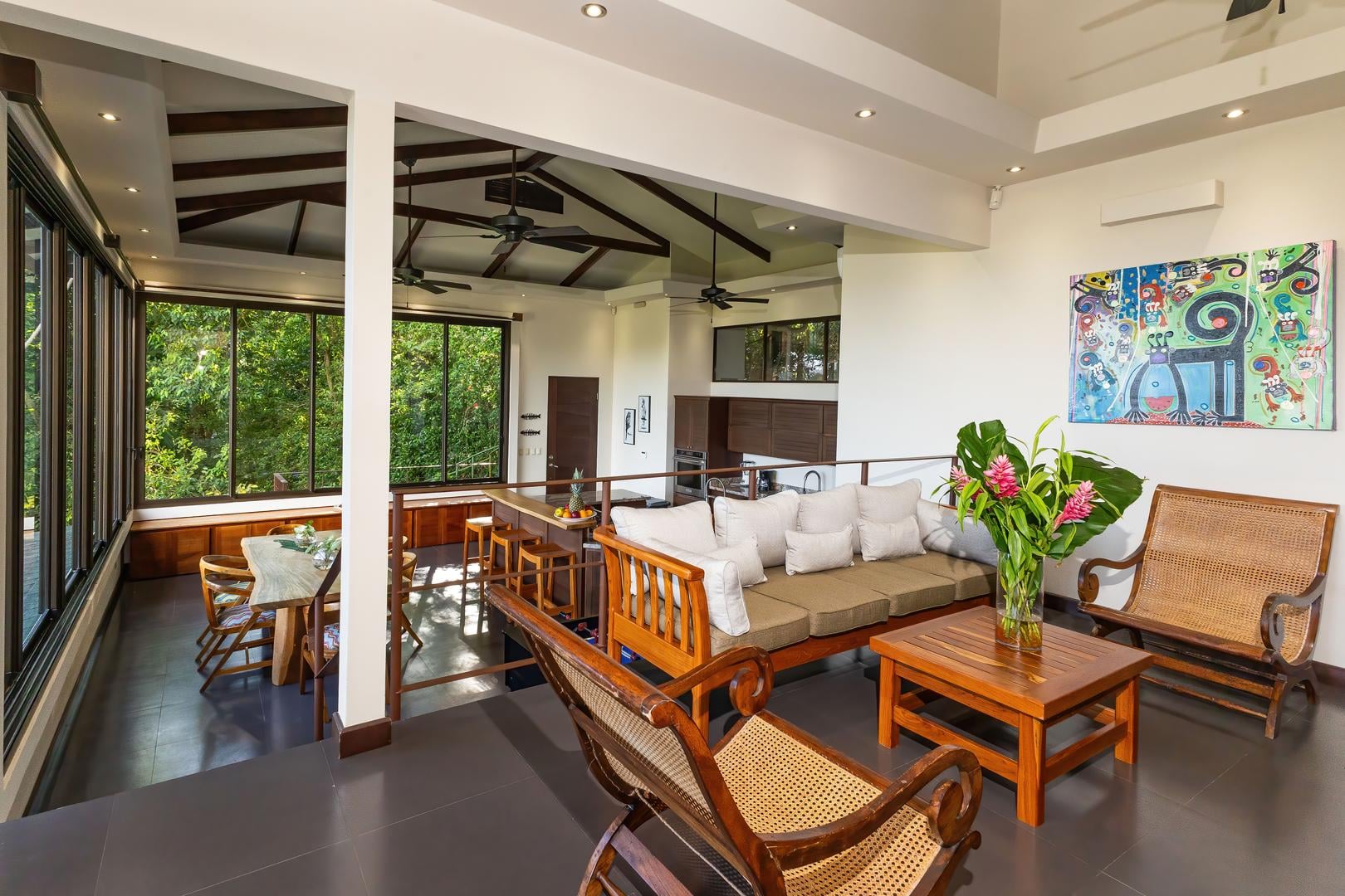 Upper-level lounge with seating, open layout, and views across the living spaces