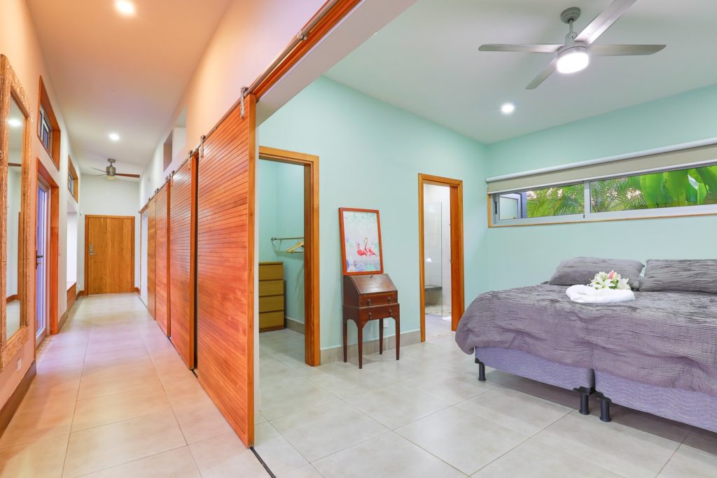 Large bedroom doors allow the mountain air to flow freely.