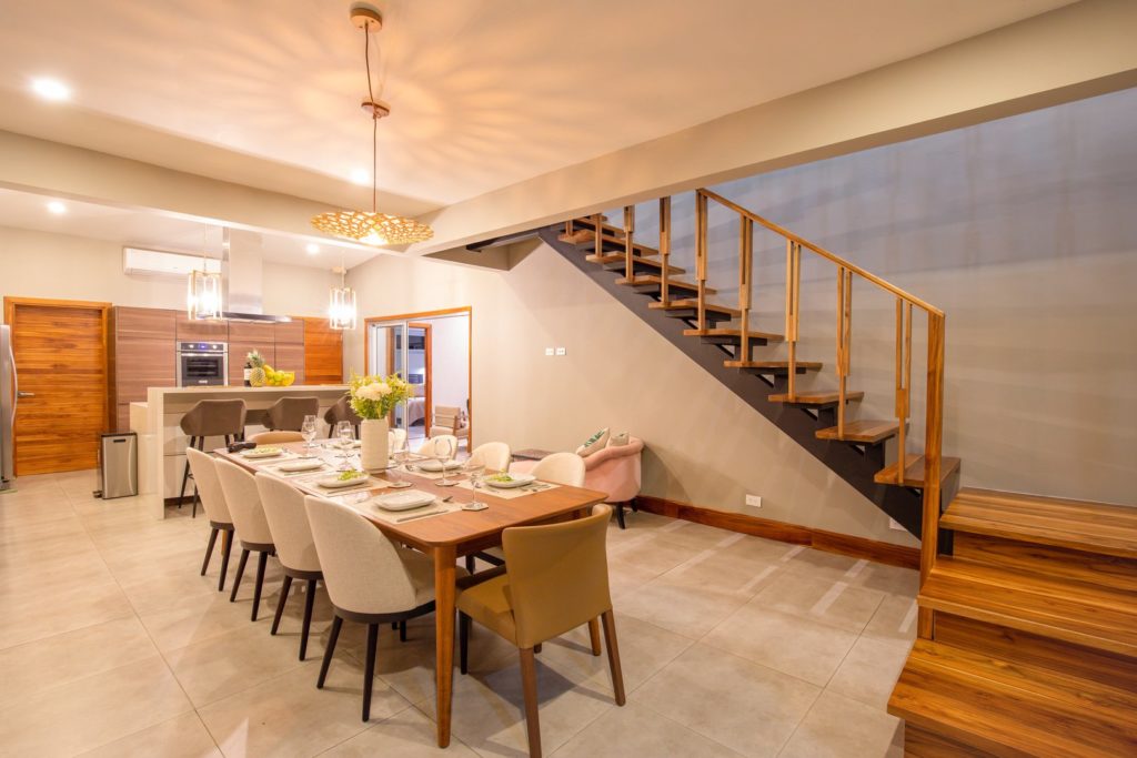 An elegant modern staircase in the spacious dining room.
