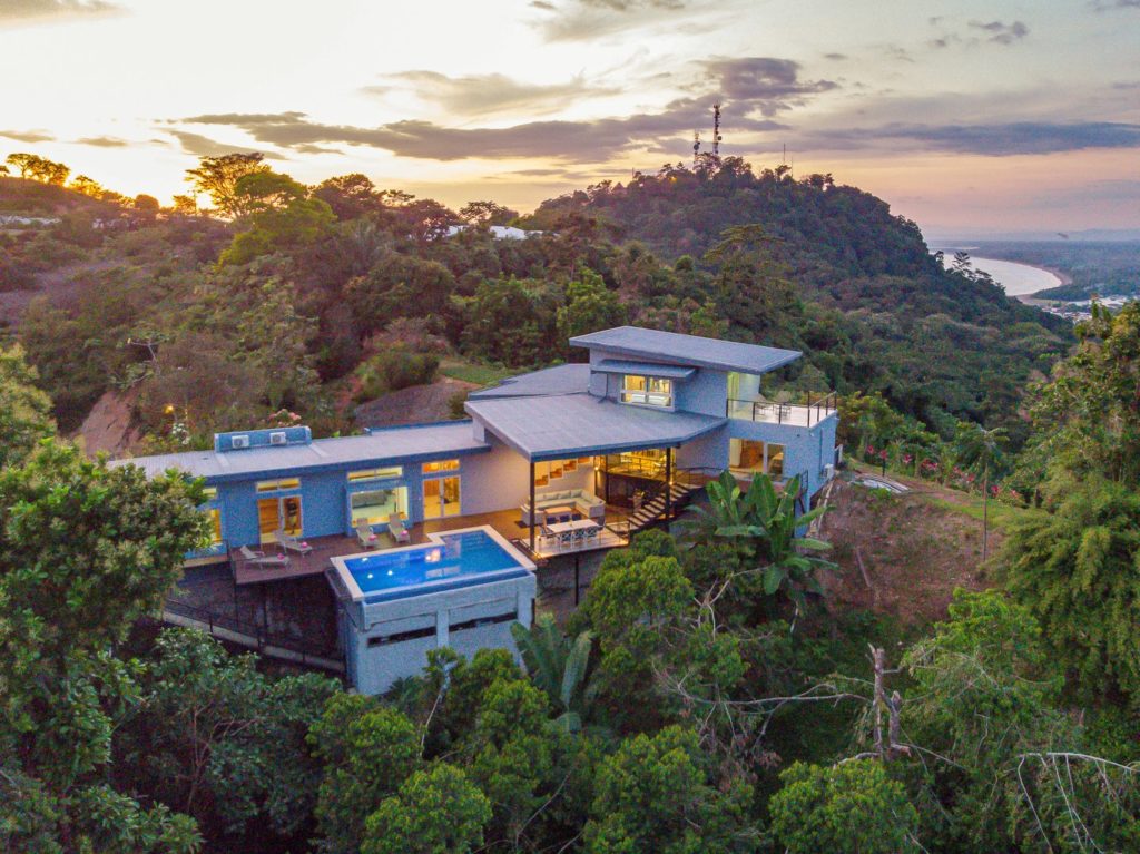 The luxury private house sits on a secluded mountain surrounded by jungle.