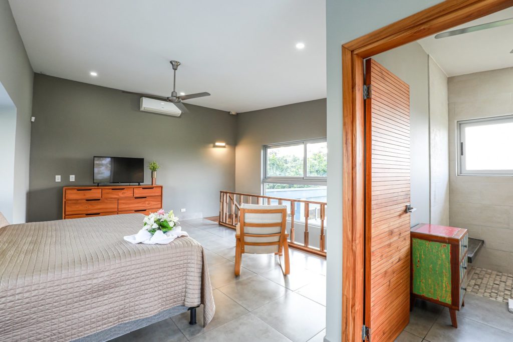 A beautiful master bedroom sits at the top of the property with outstanding views of Manuel Antonio.