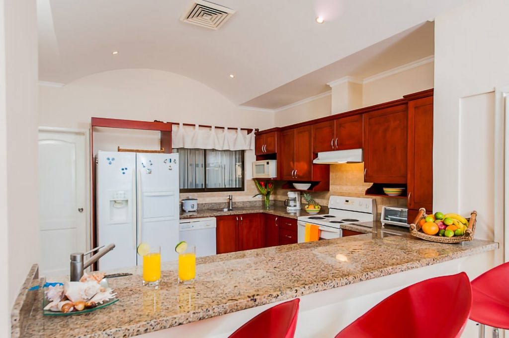 Preparing a meal can be communal and enjoyable with this open gallery-style kitchen.