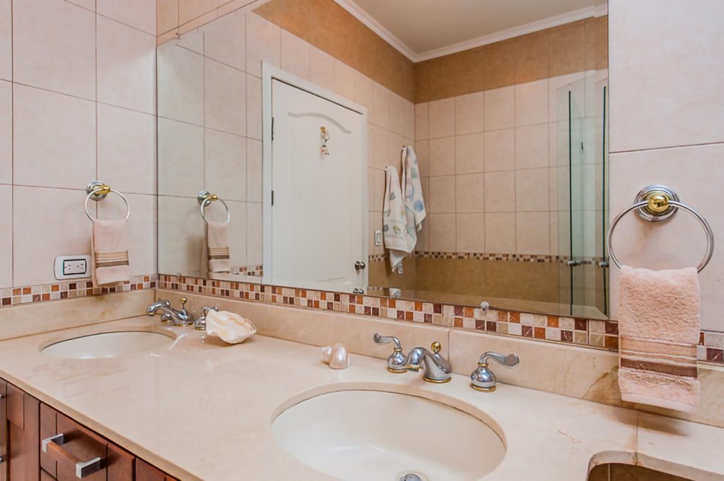 The master bedroom ensuite bathroom features convenient his and hers sinks.