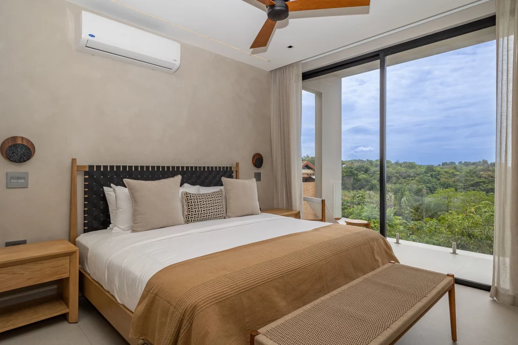 Wake up to gorgeous floor-to-ceiling tropical rainforest views.