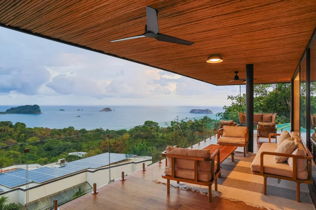 The vibe on the balcony is warm and inviting with a natural cane ceiling and a wooden floor.