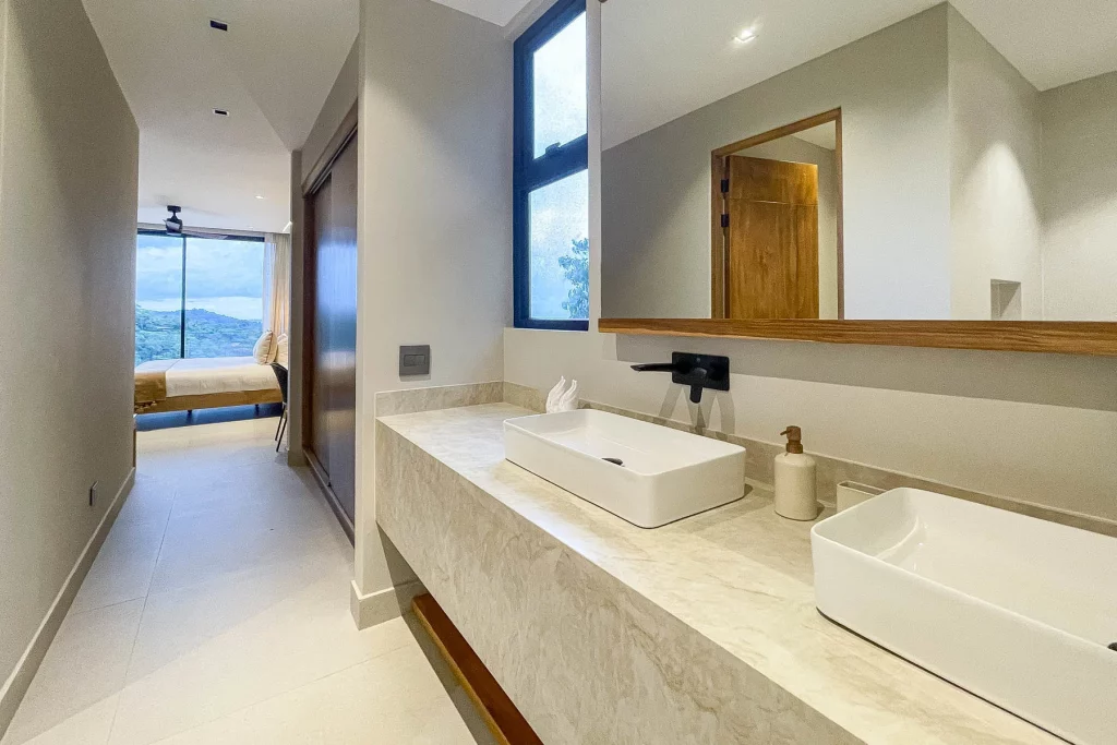 Huge closets, his and hers sinks, this ensuite bathroom is simple, beautiful, and functional.