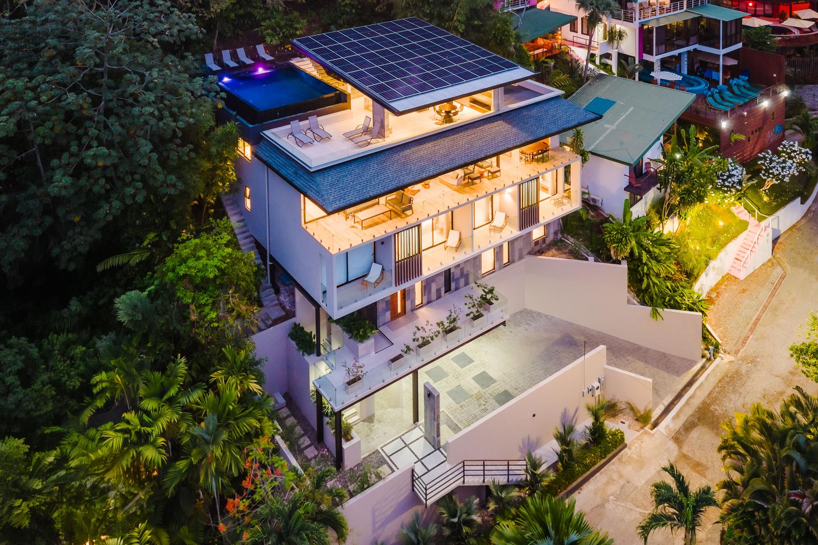 Luxury villa at night with rooftop pool and illuminated terraces Manuel Antonio Costa Rica