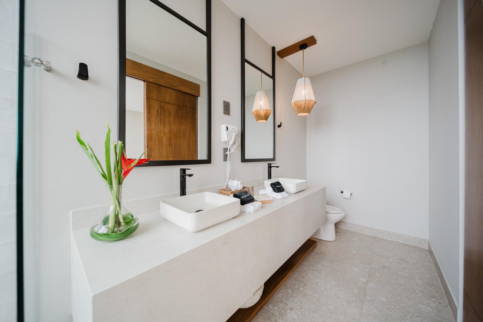Modern bathroom with double vanity and mirrors in Manuel Antonio Costa Rica