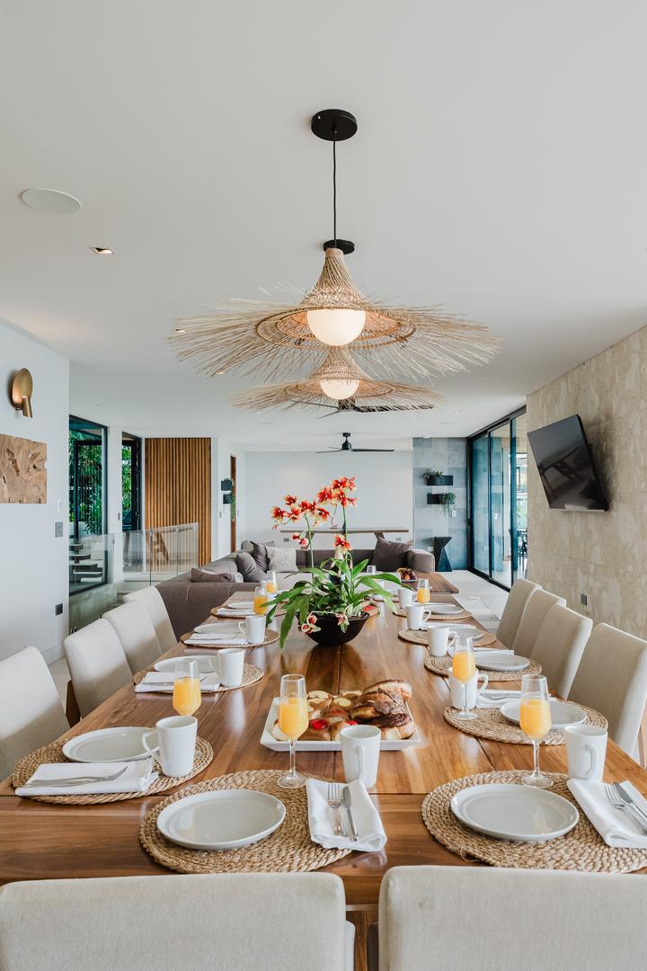 Dining table in open concept living area with natural light Manuel Antonio Costa Rica