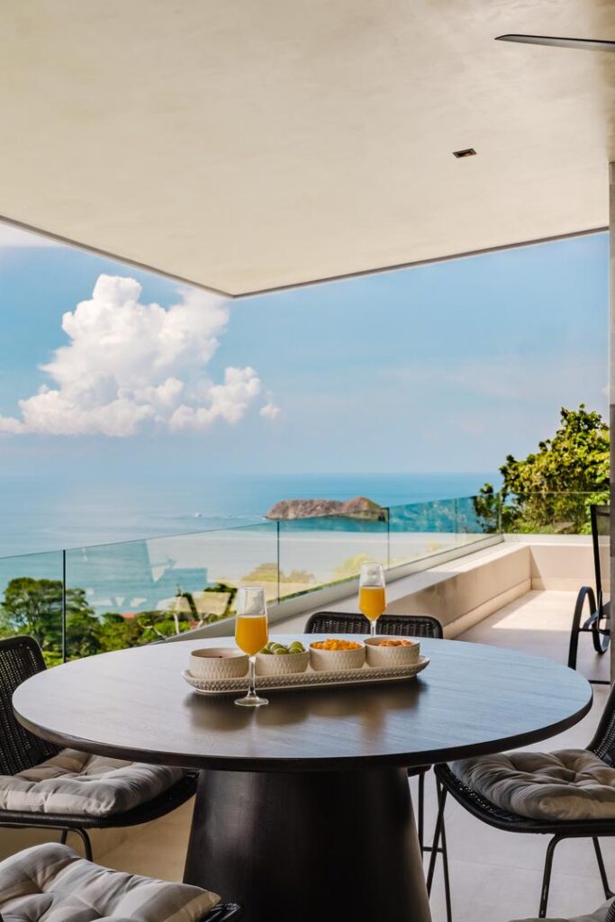 Casual dining set against open ocean views and a steady coastal breeze.