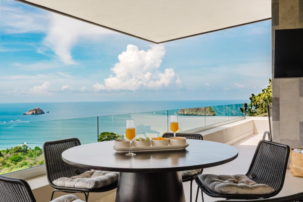 Outdoor dining table on terrace with ocean view in Manuel Antonio Costa Rica