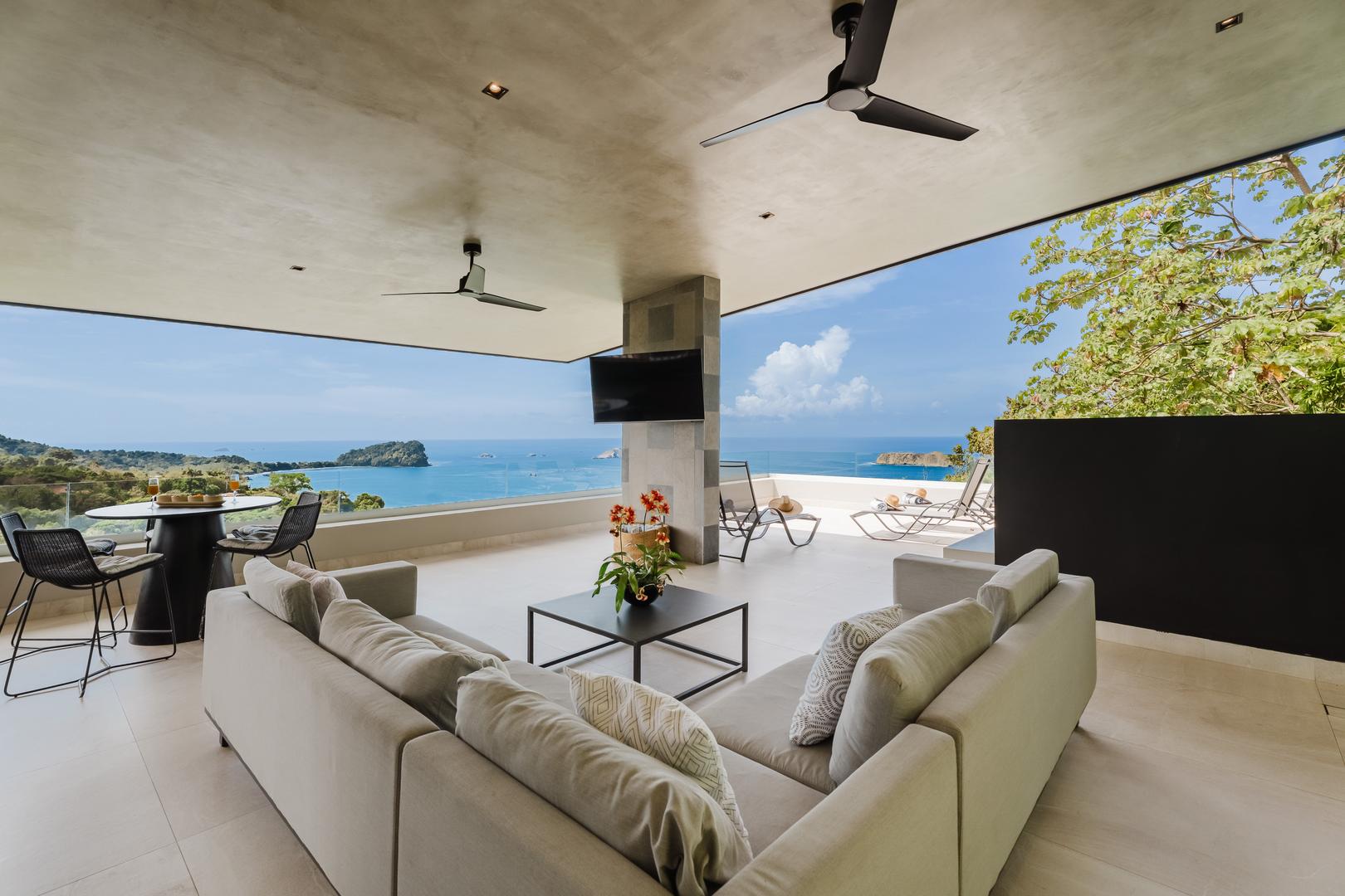 Open-air living area with seating and ocean view in Manuel Antonio Costa Rica