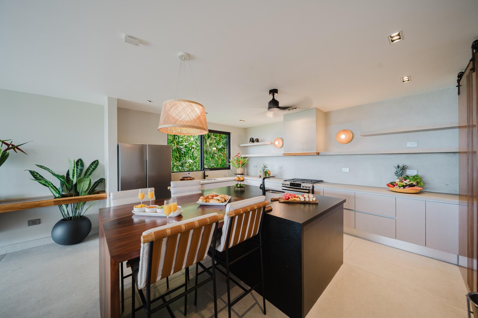 Modern kitchen with island and bar seating in Manuel Antonio Costa Rica