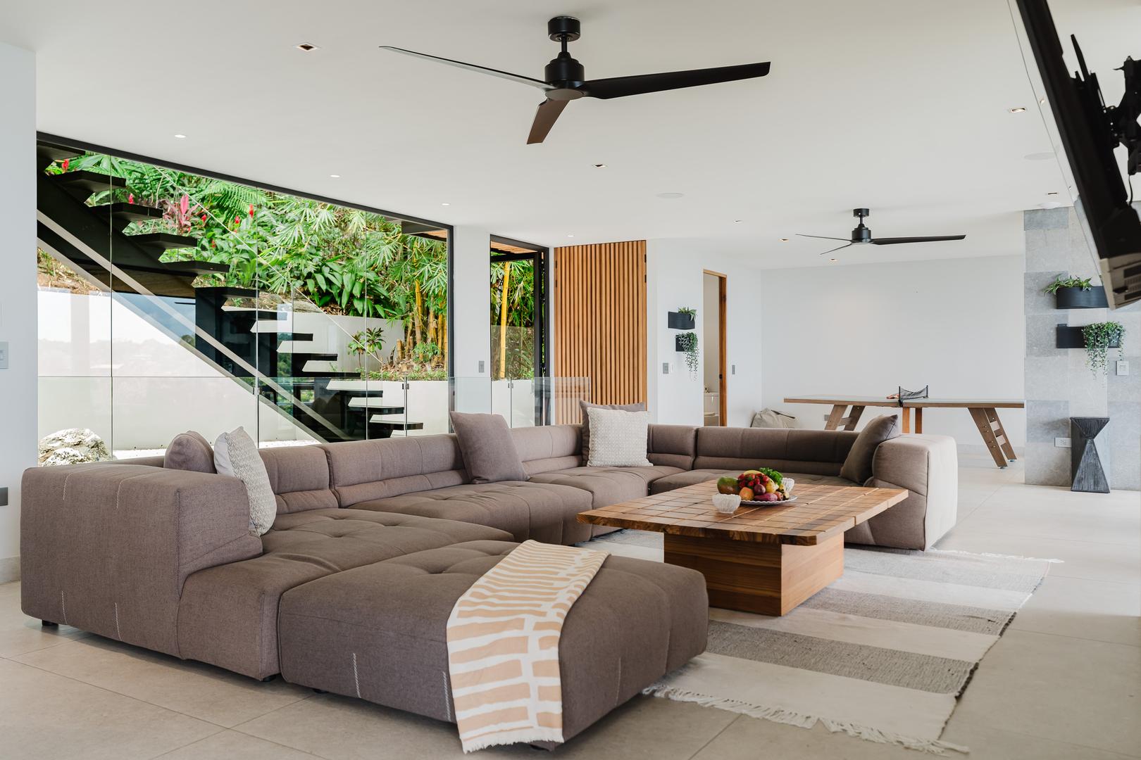 Spacious modern living room with large sectional sofa in Manuel Antonio Costa Rica