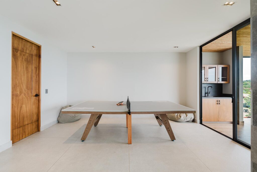 A pared-back game room where play remains simple and unhurried.