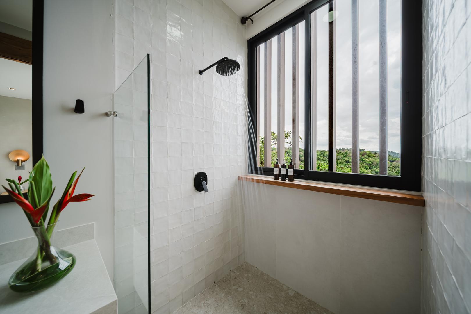 Modern shower with window and jungle view in Manuel Antonio Costa Rica